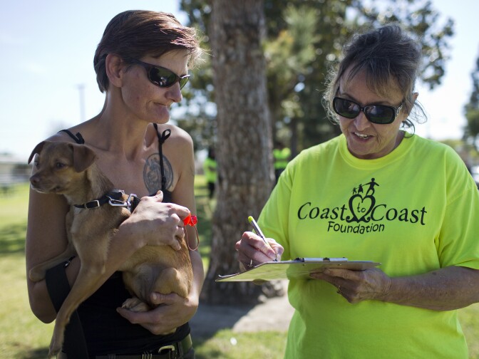 Volunteer Marge Preston, right, works with Angela Colantuono during a weekly outreach assessment put on by the Coast to Coast Foundation in partnership with the Fullerton Police Department on Thursday, March 5, 2015 at Pacific Drive Park. Colantuono has been homeless in Fullerton for seven years. She asks for help with health insurance on Thursday.