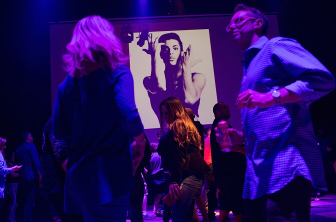 MINNEAPOLIS, MN - APRIL 21:  Guests dance to Prince music as a slide show flashes images of the artist above the stage during a memorial dance party at the First Avenue nightclub on April 21, 2016 in Minneapolis, Minnesota. Prince, 57, was pronounced dead shortly after being found unresponsive at Paisley Park Studios in Chanhassen, Minnesota near Minneapolis.  (Photo by Scott Olson/Getty Images)