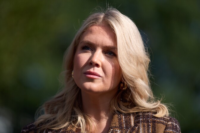 A white woman with blonde hair is seen in sunlight.