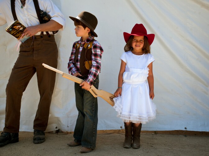 Logan, 7, and Paloma Lilly, 6, of Valencia dress up for Sunday's Cowboy Festival. The family loves the Wild West, and has lots of Western clothing pieces at home.