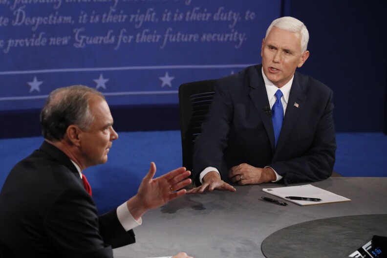 Democratic candidate for Vice President Tim Kaine (L) speaks as Republican candidate for Vice President Mike Pence looks on during the first vice presidential debate at Longwood University in Farmville, Virginia on October 4, 2016.
Hillary Clinton and Donald Trump's running mates carry the race for the White House Tuesday, in their only debate of the campaign with the US elections five weeks away. / AFP / POOL / ANDREW GOMBERT        (Photo credit should read ANDREW GOMBERT/AFP/Getty Images)