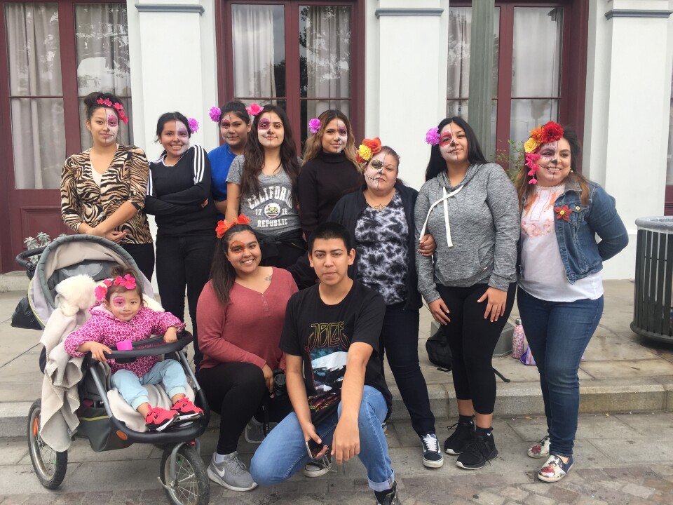 Students from YouthBuild Charter School, El Monte went to Olvera Street to do what their teacher calls a "community circle." They sat on the pavement outside of Pico House and shared stories about loved ones they lost. 