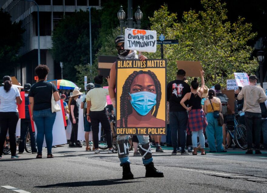 People protest against the death of George Floyd and others in police custody, as they support the Black Lives Matter movement outside the Hall of Justice in Los Angeles, California on June 24, 2020. (Photo by Mark RALSTON / AFP) (Photo by MARK RALSTON/AFP via Getty Images)