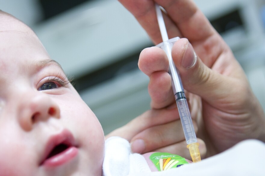 Child getting vaccinated for measles, mumps, and rubella (MMR)