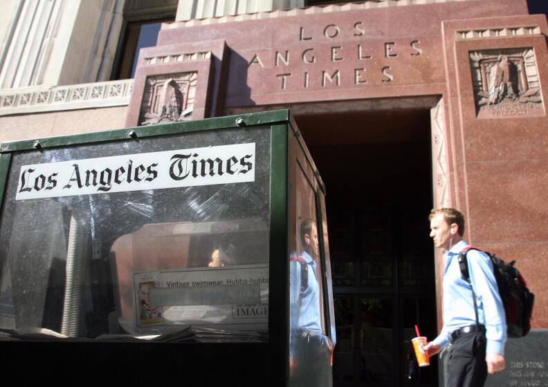 Los Angeles, UNITED STATES: The "Los Angeles Times" newspaper building in downtown Los Angeles,24 April 2007. The Los Angeles Times will offer buyouts to up to 150 employees to offset declining circulation and advertising in the latest effort by parent company Tribune Co. to cut jobs ahead of its plan to go private in an 8.2 billion USD deal. The buyouts would equal three percent to five percent of workers at the Times, Tribune's largest newspaper, publisher David Hiller wrote in a note to the staff.    AFP PHOTO/GABRIEL BOUYS (Photo credit should read GABRIEL BOUYS/AFP/Getty Images)