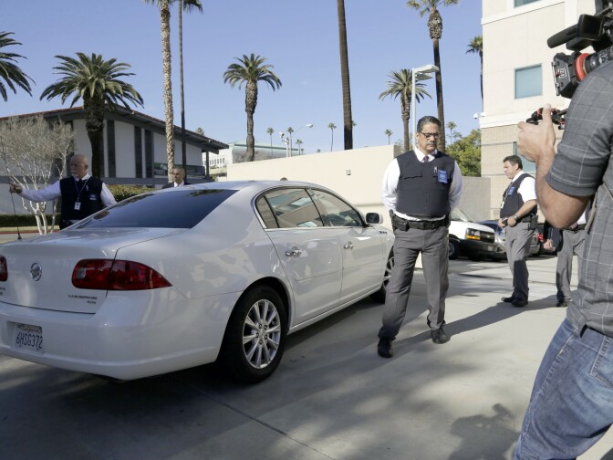 Security is tight as a car carrying Enrique Marquez Jr. arrives at U.S. District Court in Riverside, Calif., Thursday, Dec. 17, 2015. Marquez, a longtime friend of Syed Rizwan Farook, the male shooter in the San Bernardino terrorist attack, was charged today with conspiring with Farook in 2011 and 2012 to commit crimes of terrorism, and with the unlawful purchase of two assault rifles used in the deadly shooting two weeks ago.