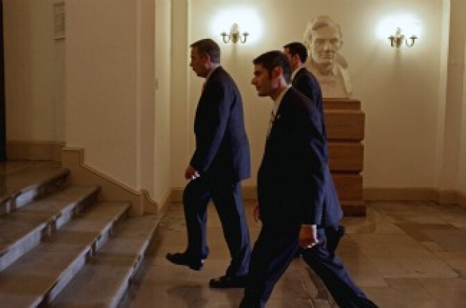 While whistling and singing 'Zip-a-Dee-Doo-Dah,' Speaker of the House John Boehner (R-OH) walks past a statue bust of President Abraham Lincoln after arriving at the U.S. Capitol July 29, 2011 in Washington, DC.