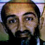 Afghans watch television coverage announcing the killing of Al-Qaeda leader Osama bin Laden at an electronics store on May 2, 2011 in Kabul, Afghanistan.