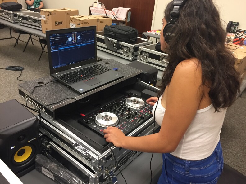 DJ Sol a.k.a. 20-year-old Adriana Medina works on her mix at the Compton public library.