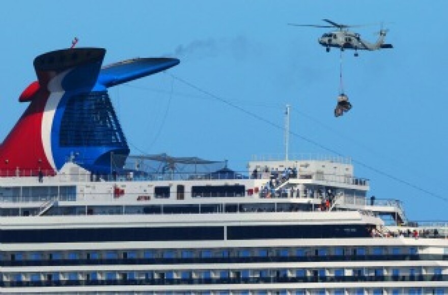 A Navy HH-60H Sea Hawk helicopter from the aircraft carrier USS Ronald Reagan delivers pallets of supplies to the Carnival cruise ship C/V Splendor November 9, 2010 off the coast California.