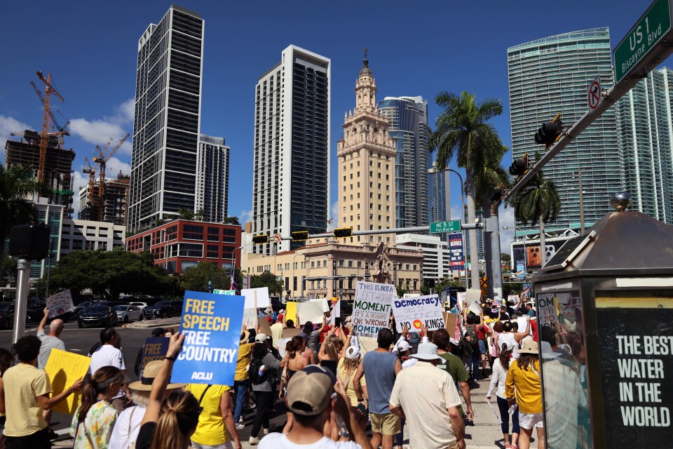 protesters are in a crowded downtown square.