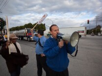 Carson Mayor Jim Dear speaks to protestors outside the Shell Oil facility in South Los Angeles.