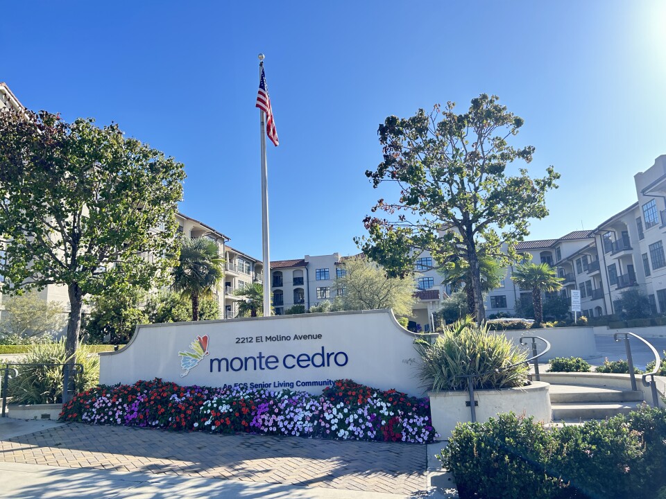 A sign reads: MonteCedro. The multi-story complex has balconies and landscaping
