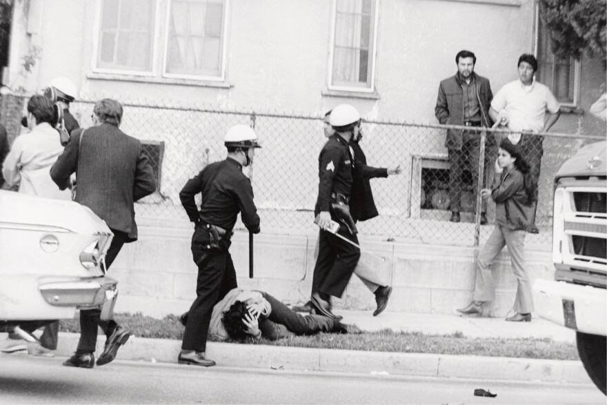 Boyle Heights, 1968. "Some kid got hit on the head by the cops during the Walkouts. I called these images 'a field day for the heat.' They were just kids."
