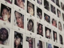 Photographs found in the possession of Lonnie David Franklin Jr. are shown during a news conference in Los Angeles Dec. 16, 2010. Bracing for a flood of tips from the public, detectives released dozens of photographs of unidentified women that were found at the home of the suspected "Grim Sleeper" serial killer.