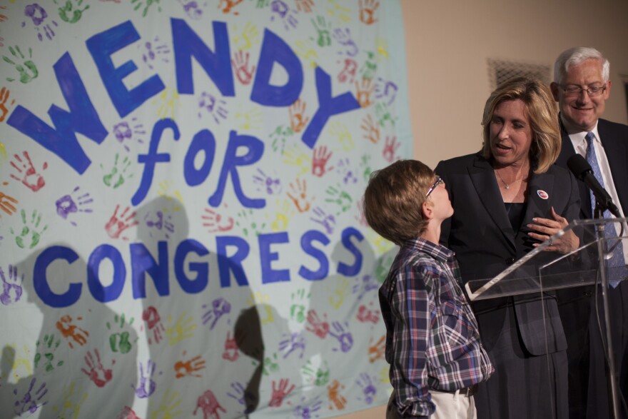 Candidate for the 33rd Congressional District Wendy Greuel addresses the crowd during a primary election party at her campaign office in Santa Monica. With her is her son, Thomas Schramm, left, and husband, Dean Schramm.