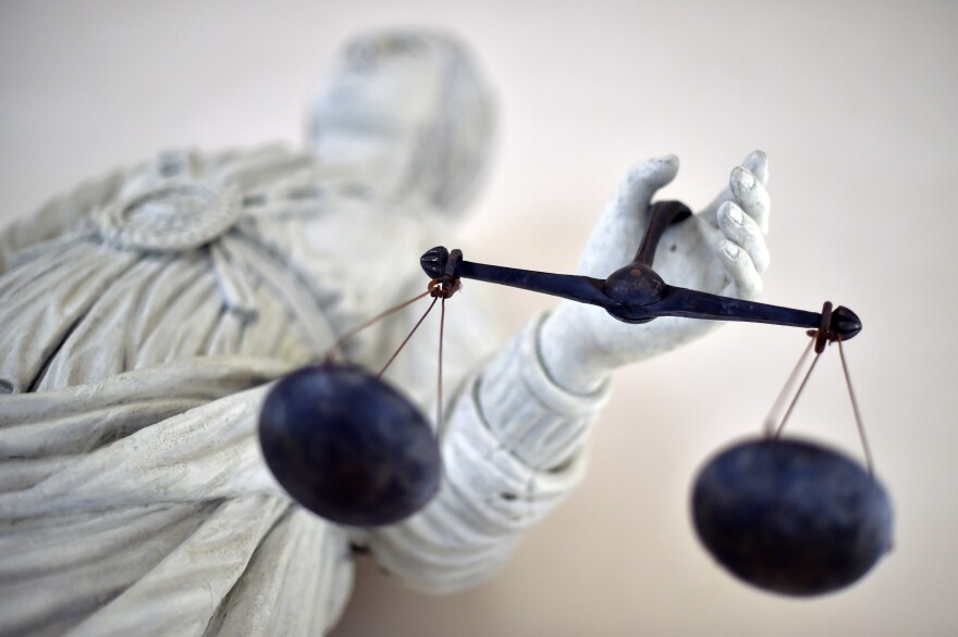 A statue of the Goddess of Justice balances the scales on September 19, 2017 at the Rennes' courthouse.
