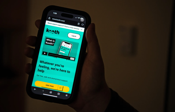 an iphone with a turquiose screen with black text and a yellow "home page" button