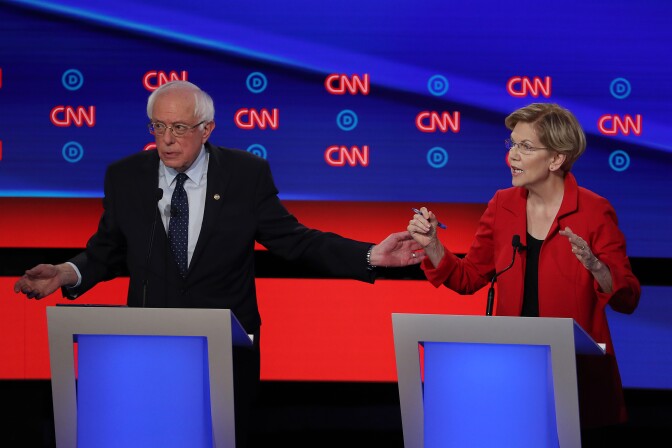 DETROIT, MICHIGAN - JULY 30: Democratic presidential candidate Sen. Bernie Sanders (I-VT) (L) and Sen. Elizabeth Warren (D-MA) speak during the Democratic Presidential Debate at the Fox Theatre July 30, 2019 in Detroit, Michigan. 20 Democratic presidential candidates were split into two groups of 10 to take part in the debate sponsored by CNN held over two nights at Detroit’s Fox Theatre.  (Photo by Justin Sullivan/Getty Images)