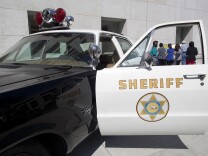 An old Los Angeles County Sheriff vehicle is parked outside of the Hall of Justice during the opening ceremony.