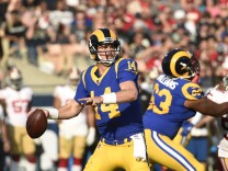Quarterback Sean Mannion #14 of the Los Angeles Rams throws against San Francisco 49ers during the second quarter at Los Angeles Memorial Coliseum on December 31, 2017 in Los Angeles, California.