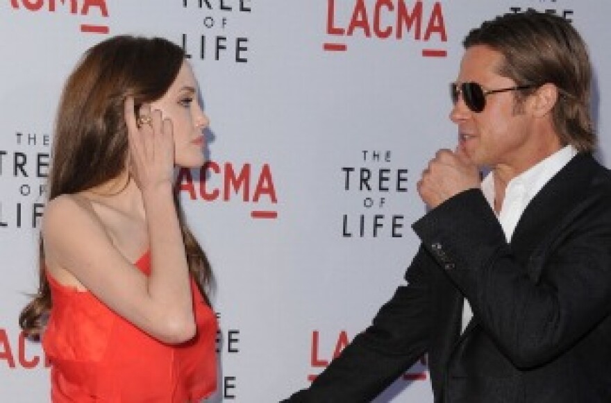 Actors Angelina Jolie and Brad Pitt arrive at the premiere of Fox Searchlight Pictures' 'The Tree of Life' at the Bing Theatre at the Los Angeles County Museum of Art on May 24, 2011 in Los Angeles, California.