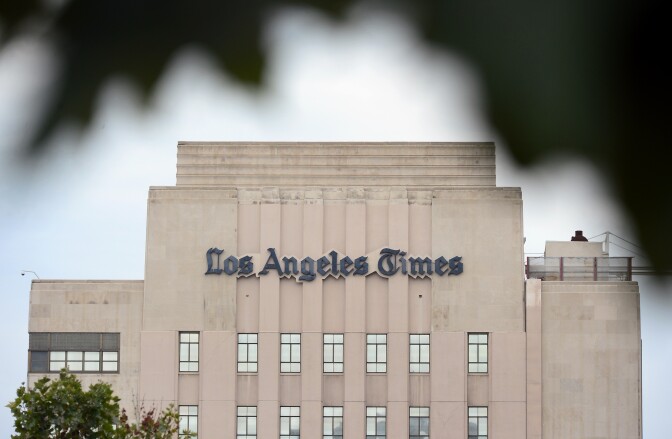 The Los Angeles Times Building in downtown Los Angeles, California on July 10, 2013.  The Tribune Company, a group which owns 23 television stations, announced plans Wednesday to spin off its newspaper division, which includes the Los Angeles Times and Chicago Tribune, separating the struggling unit from its growing television station holdings. Tribune Company  last week announced a $2.7 billion deal to buy 19 more local television stations and has said splitting into two distinct companies would give each "greater financial and operational focus." AFP PHOTO/Frederic J. BROWN        (Photo credit should read FREDERIC J. BROWN/AFP/Getty Images)