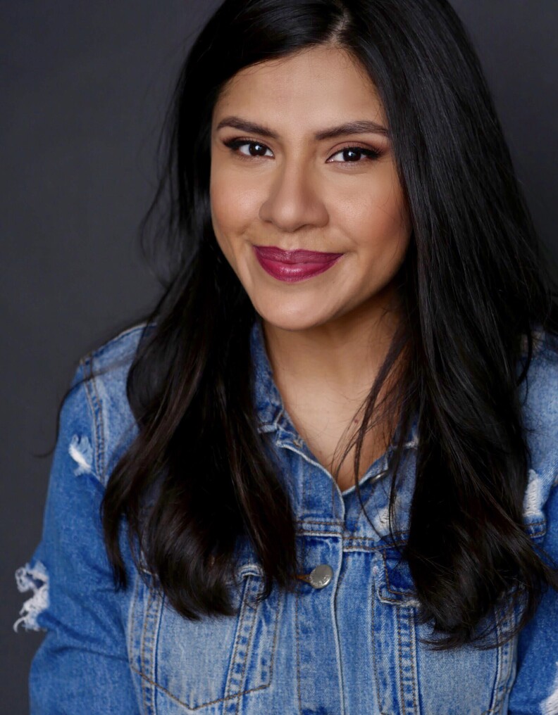 Melinna Bobadilla wears a blue jean jacket in a headshot image.