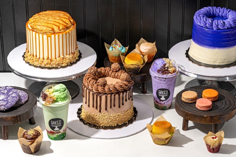 An array of cakes, desserts, cookies, muffins and shakes.