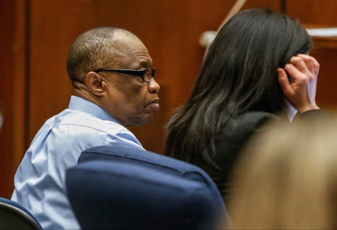FILE- In this Feb. 16, 2016, file photo, Lonnie Franklin Jr., left, appears in Los Angeles Superior Court for opening statements in his trial in Los Angeles. Franklin has pleaded not guilty to killing nine women and a 15-year-old girl between 1985 and 2007 in one of the city's most notorious serial killer cases. The "Grim Sleeper" nickname was coined because of an apparent 14-year gap in the murders between 1988 and 2002. Franklin's attorney, Seymour Amster, is set to deliver his opening statement to jurors on Monday, March 21, 2016. (Al Seib/Los Angeles Times via AP, Pool, File)