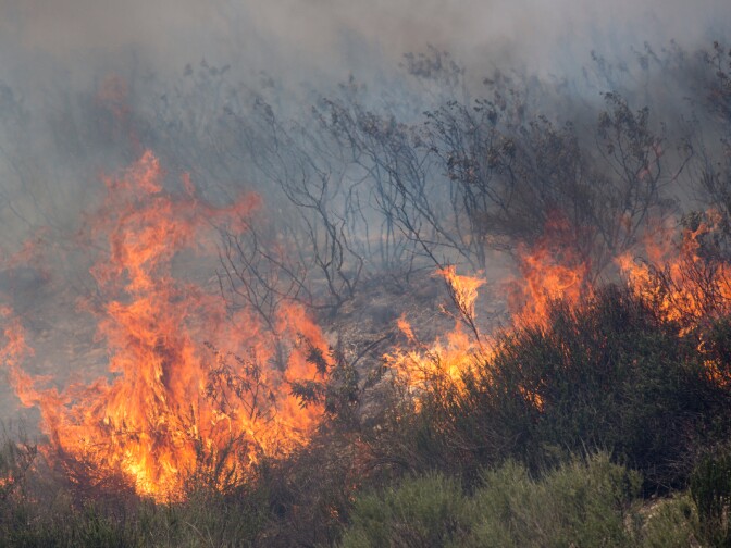 Flames burn north of Banyan Street as the Etiwanda Fire burns in Rancho Cucamonga on Wednesday, April 30, 2014.