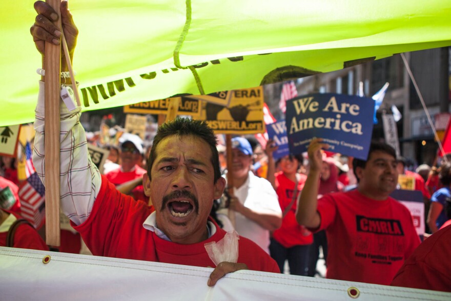 Javier Ramos of Hollywood marches down Broadway in Downtown Los Angeles with other members of CHIRLA.