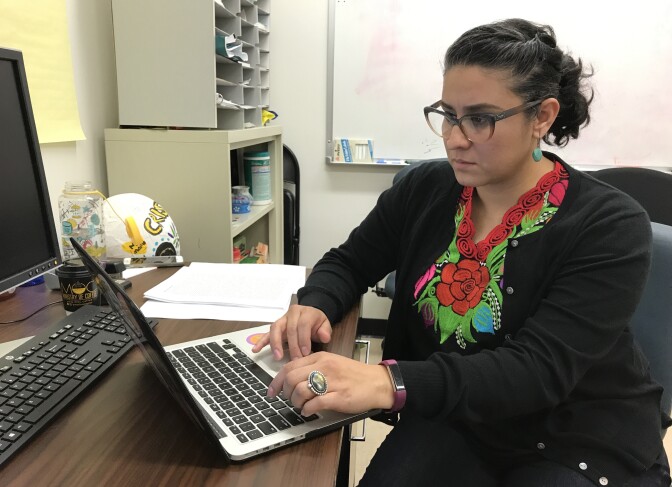 Christine Vega helps run an advocacy group for parenting students at UCLA called Mothers of Color in Academia, Jan. 16, 2018. 