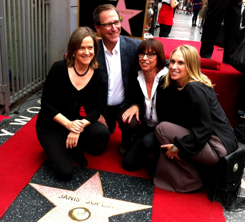 Members of Janis Joplin's family pose in front of Joplin's new star on the Hollywood Walk of Fame, 43 years after the singer's death from an overdose.
