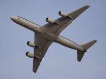 The under belly of a plan is visible while airborne.