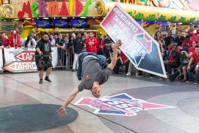 An AArrow sign spinner at the World Sign Spinning Championships.