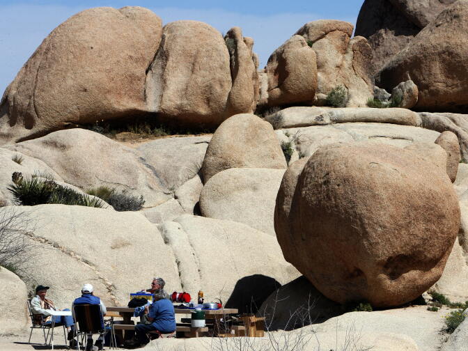 People have a picnic at Hidden Valley in the 1,234-square-mile Joshua Tree National Park. 