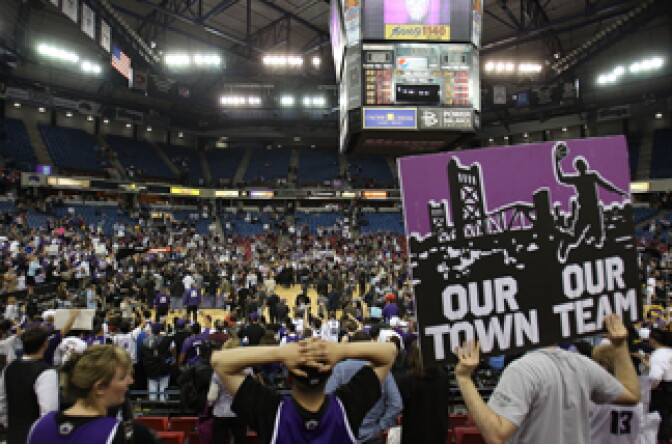 Fans of the Sacramento Kings hold up signs against the Los Angeles Lakers on April 13, 2011 at Power Balance Pavilion in Sacramento, California.