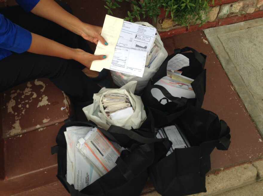 Isabel Medina of East Los Angeles and her husband have saved bags full of receipts, bills and other documents to prove their long-term residency in the United States. Both hope to obtain temporary legal status under Obama's executive immigration plan, as the parents of two U.S. citizen children. 