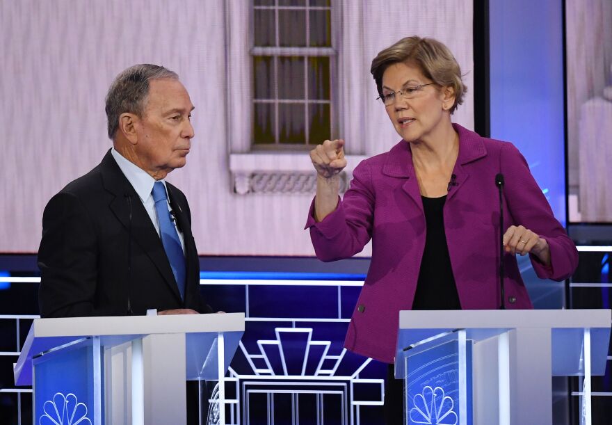 Democratic presidential hopefuls Former New York Mayor Mike Bloomberg and Massachusetts Senator Elizabeth Warren speak during a break in the ninth Democratic primary debate of the 2020 presidential campaign season co-hosted by NBC News, MSNBC, Noticias Telemundo and The Nevada Independent at the Paris Theater in Las Vegas, Nevada, on February 19, 2020. (Photo by Mark RALSTON / AFP) (Photo by MARK RALSTON/AFP via Getty Images)