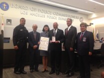 Police Commission and long-time Los Angeles civil rights leader John Mack (center) was honored by his commission colleagues with a distinguished service award for 8 years on the board. 