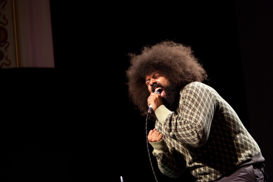 Reggie Watts performs on stage as the final presenter of PopTech 2011, on Saturday night