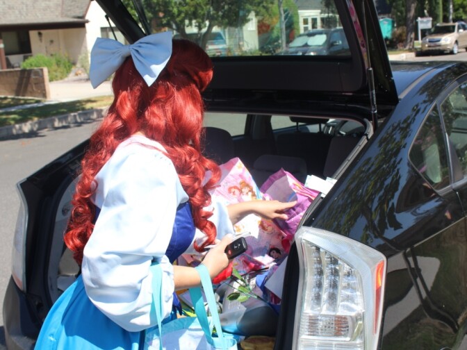 Jennifer Michele packs up her Prius before a gig as the Little Mermaid in Burbank.