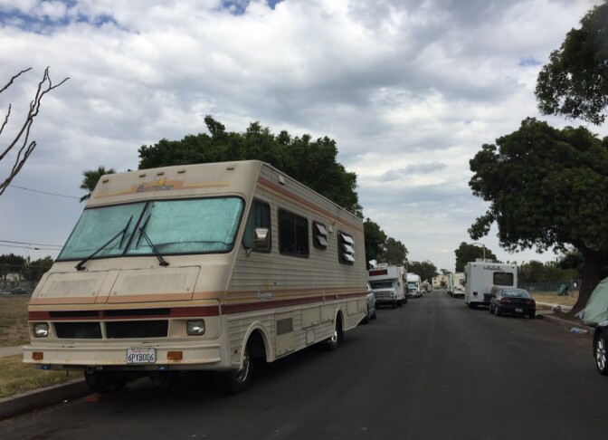 RV's and tents line the empty lots of Manchester Square.