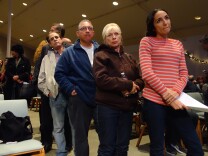                                Porter Ranch resident Nicole Abraham, in the red shirt, waits her turn to ask attorneys a question about the massive gas leak at the nearby Aliso Canyon underground gas storage field.