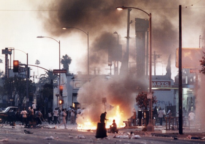 Scene from 1992 and the corner of corner of Florence and Normandie.  (credit Kirk McKoy / Los Angeles Times)
