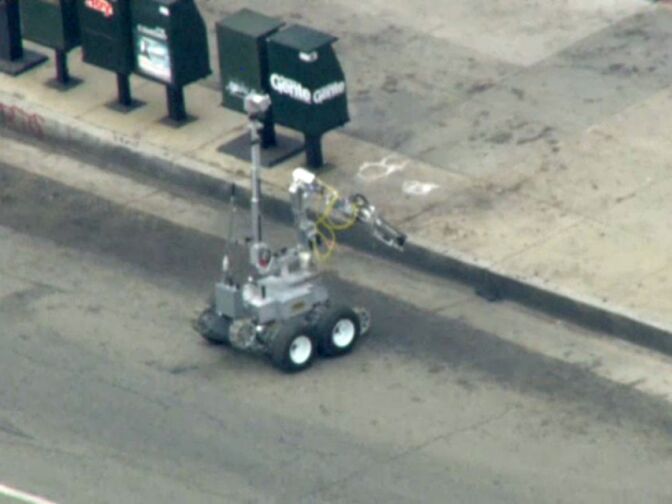 A bomb squad robot outside an East L.A. bank on Wednesday, Sept. 5, 2012.