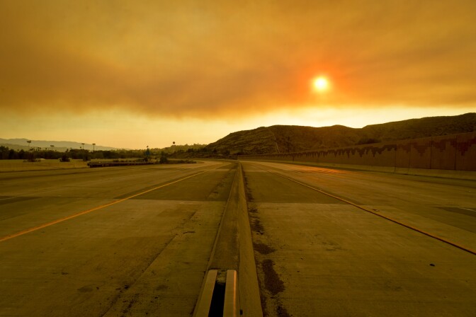 The 14 Freeway in the Antelope Valley was closed to vehicles Sunday afternoon as the Sand Fire burned near the freeway. 

The Sand Fire burns in the Angeles National Forest Sunday July 24th, 2016 under a Red Flag Warning high high winds. The fire had burned 22,000 acres by Sunday morning and was 10% contained as firefighters battled low humidity, shifting wind, and high temperatures. An unknown number of structures were lost. 
