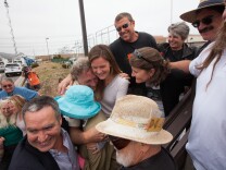 Environmental activists hug at a press conference outside of the San Onofre nuclear plant on June 7th, 2013. Edison announced that the plant will be shut down permanently.