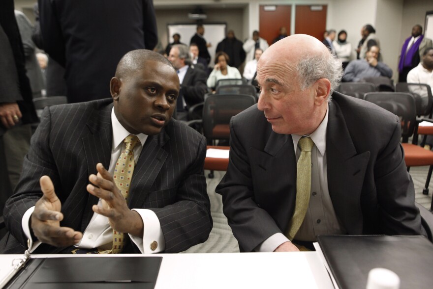 Dr. Bennet Omalu, left, Co-Director, Brain Injury Research Institute, West Virginia University talks with Dr. Ira R. Casson, Neurologist and former co-chairman, NFL Mild Traumatic Brain Injury Committee, before a House Judiciary Committee hearing entitled "Legal Issues Relating to Football Head Injuries, Part II" in Detroit, Monday, Jan. 4, 2010. The House Judiciary Committee heard from retired players at the hearing today on head injuries in football, following up an Oct. 28 hearing in Washington where lawmakers questioned NFL  football commissioner Roger Goodell about the league's approach to concussions. (AP Photo/Paul Sancya)